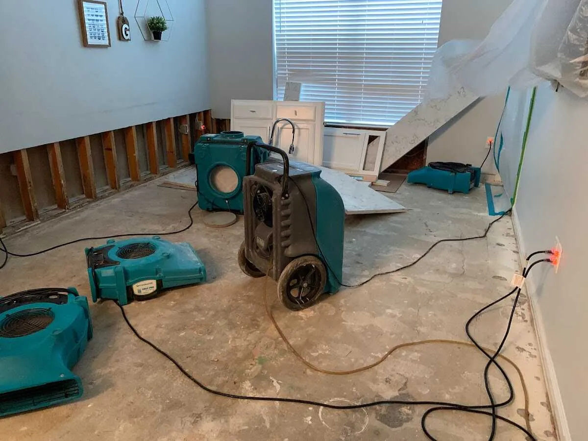 Dehumidifier in flood-cut room for Water Damage Restoration in Torrington
